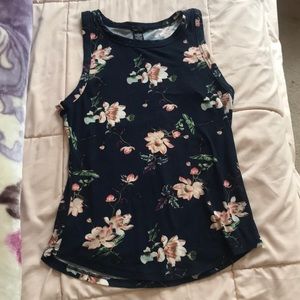 Dark blue girls shirt, floral design. Worn once!!